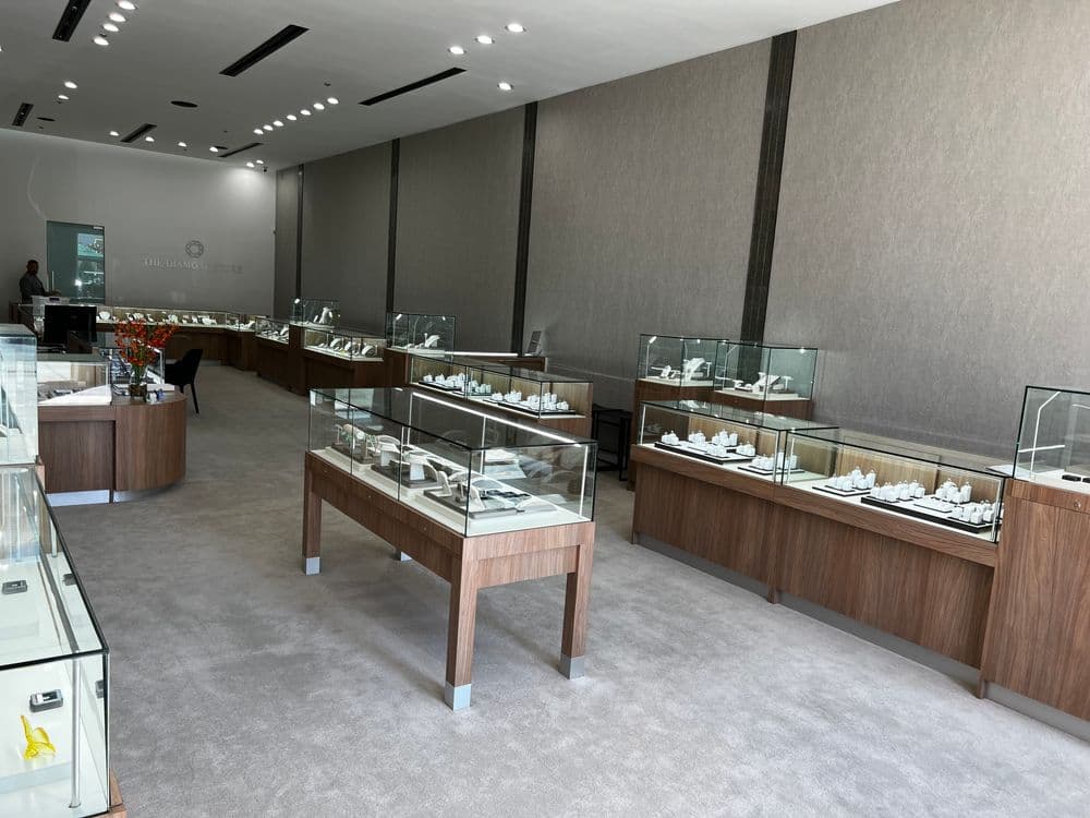 Jewelry store interior showcasing elegant display cases filled with fine jewelry pieces.